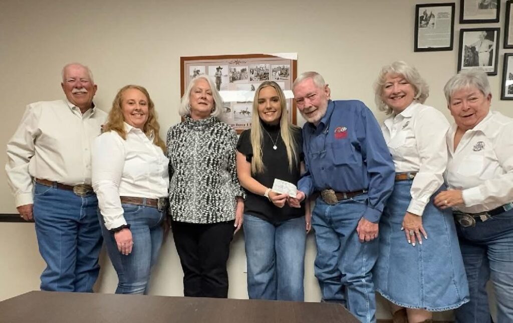 Board awarding Shelby Schmid the Dabbs scholarship 2025.